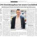 Ein Zeitungsartikel mit dem Porträt eines Mannes in einem blauen Anzug mit der Überschrift ALKONI Einrichtungshaus hat neuen Geschäftsführer.