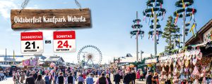 Oktoberfest im Kaufpark Wehrda; Riesenrad, Marktstände und Maibäume unter sonnigem Himmel; 21. bis 24. September.